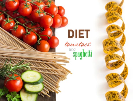 Spaghett, herbs, zucchinii and tomatoes on the old wooden tale