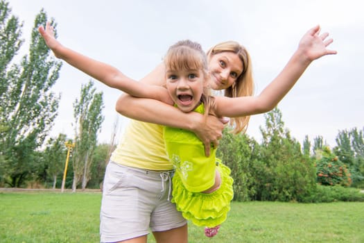 Mom keeps daughter in her arms and rocking