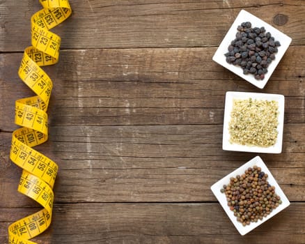 Roveja, hemp seeds and black chickpea on a wooden table