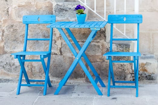 Blue Chairs and table, street greek mediterranean taverna