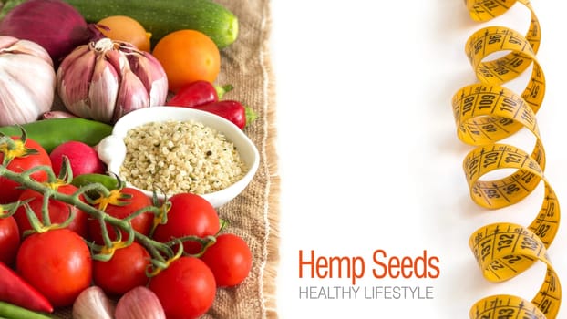Raw organic hemp seeds in a bowl and vegetables