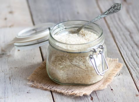 Basmati rice in a glass jar with a spoon
