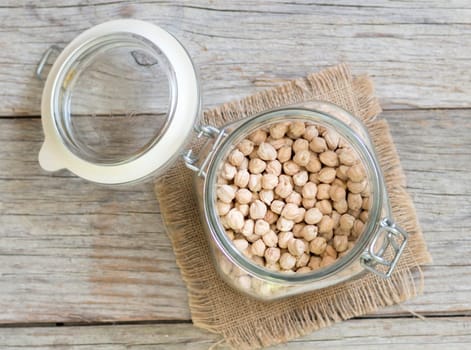 Chickpea in a glass jar on a wooden table