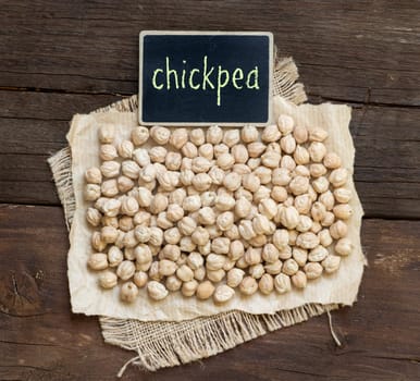 Chickpea with a small chalkboard on a wooden table