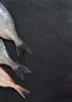 Fresh fish on a dark vintage background