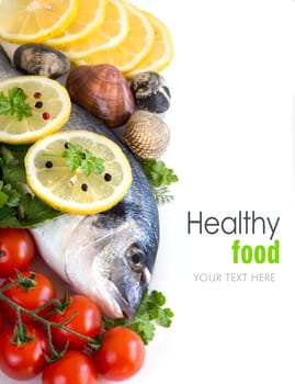 Fresh dorado fish, seafood and vegetables on a white background