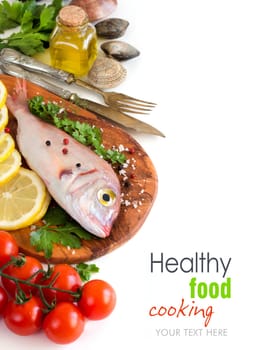 Fresh fish on a wooden board isolated on white