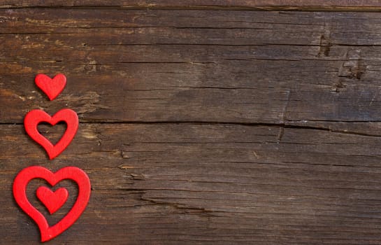 Rustic hearts on a old wooden background