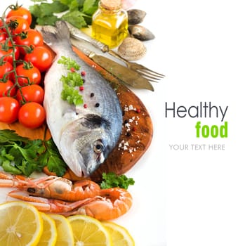 Fresh dorado fish, seafood and vegetables on a white background