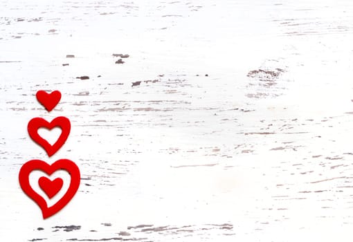 Rustic hearts on a white shabby chic background