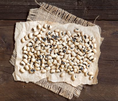 Pile of Black eyed peas on wooden background