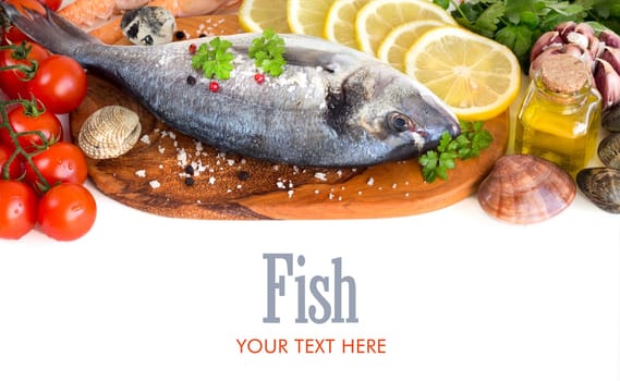 Fresh dorado fish, seafood and vegetables on a white background