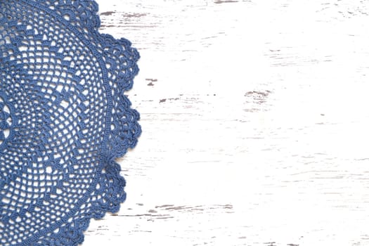 Blue Crochet doily border over shabby chic wood