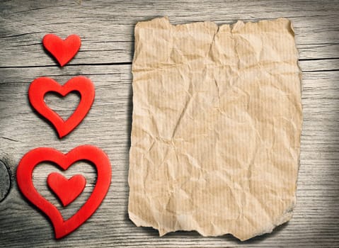 Red hearts on wood - retro background