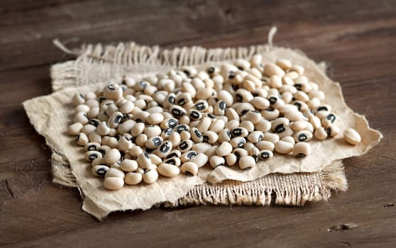 Pile of Black eyed peas on a wooden background
