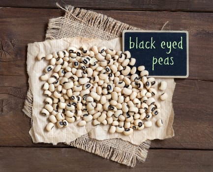 Pile of Black eyed peas with a small chalkboard