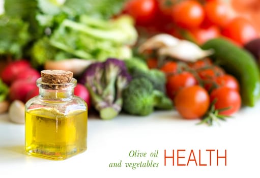 Vegetables and bottle of olive oil isolated on white border
