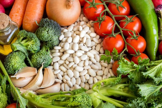 Pinto beans and vegatables on the old wooden table