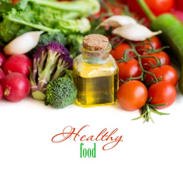 Vegetables and bottle of olive oil isolated on white border