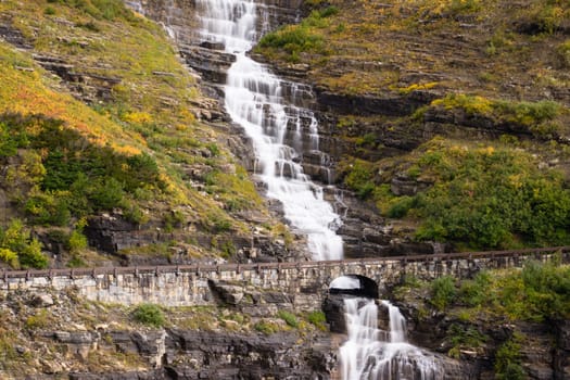 Water makes it way off glaciers under the road at Glacier National Park