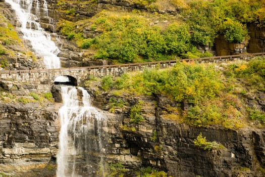 Water makes it way off glaciers under the road at Glacier National Park