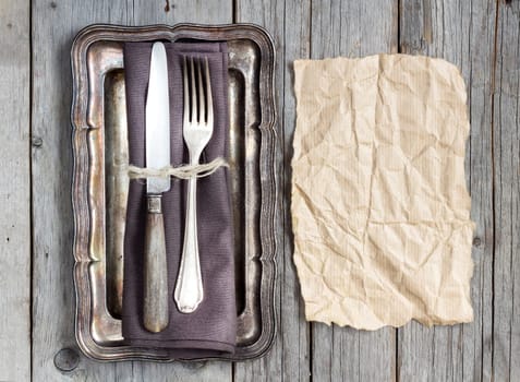 Vintage Table setting on napkin and metal tray