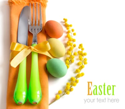Easter table setting with yellow mimosa and eggs
