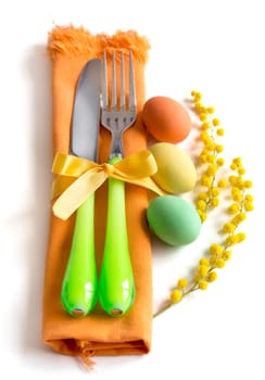 Easter table setting with yellow mimosa and eggs