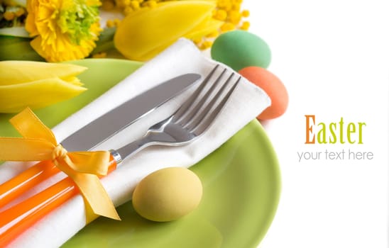 Easter table setting with yellow flowers and eggs