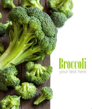 Fresh broccoli on old wooden table close up