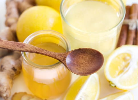 Honey, lemon, ginger tonic and ingridients close up