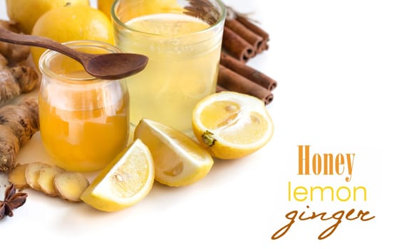 Honey, lemon and ginger tonic and ingridients isolated on white