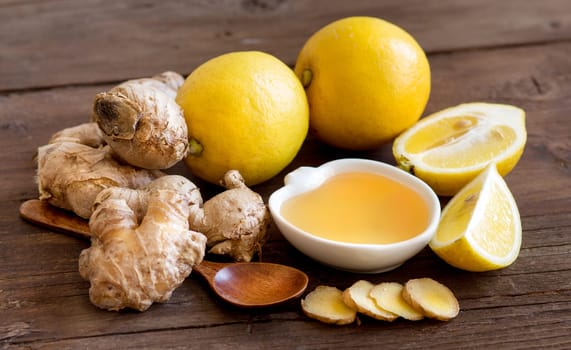 Honey, lemon and ginger on old wooden table