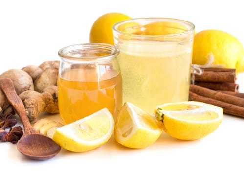 Honey, lemon, ginger tonic and ingridients isolated on white