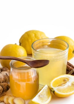 Honey, lemon and ginger tonic and ingridients close up