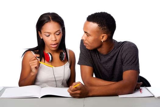 Two students happily studying together, on white.