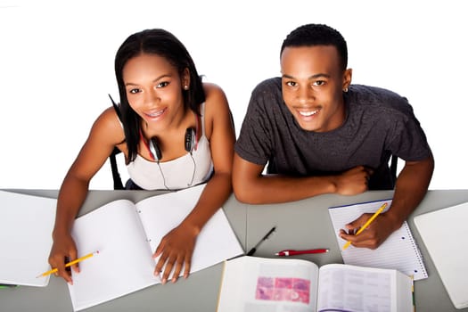 Two happy smiling academic students studying together, on white.