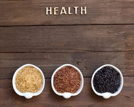 Variety of rice in bowls and word Health