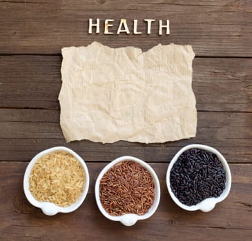 Variety of rice with craft paper and word Health
