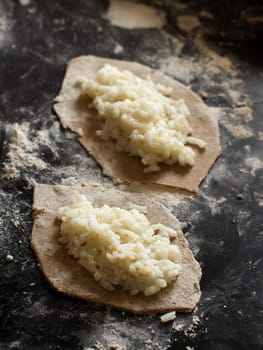 Traditional karelian pasties with rice before oven
