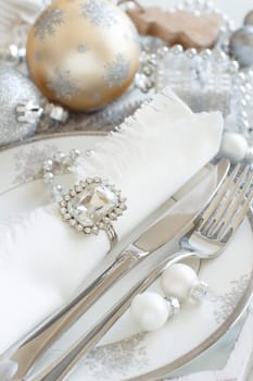 Silver and cream Christmas Table Setting with christmas decorations