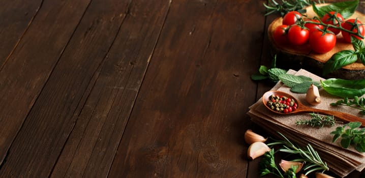 Raw lasagna pasta, vegetables and herbs on a wooden background