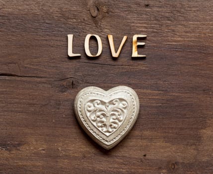 The word of Love and heart on wood