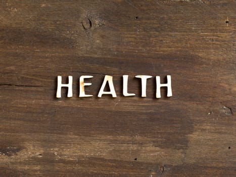 The wod of Health on wooden background