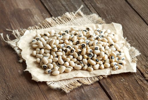 Black eyed peas close up on wooden table