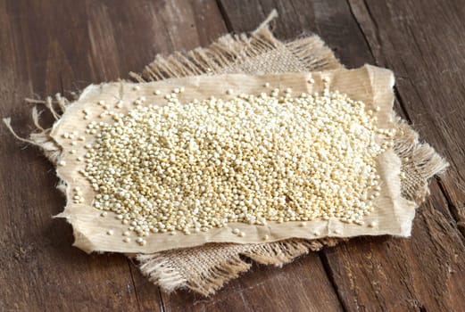 Organic quinoa on a paper and burlap