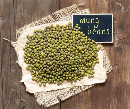 Mung beans with small chalkboard on a table