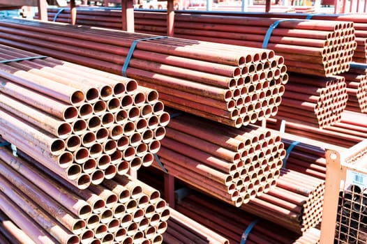 Steel Pipes bunch on the rack in warehouse