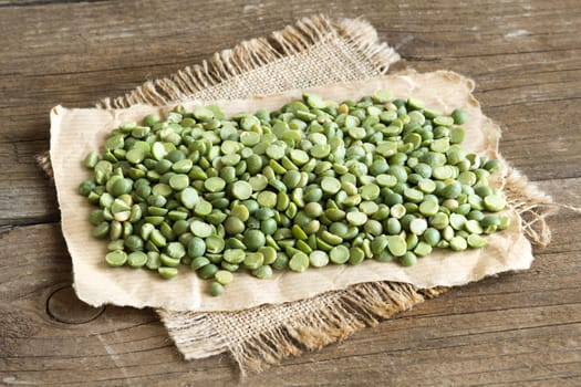 Dried Green Split Peas on a wooden table