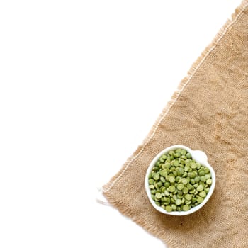 Dried Green Split Peas in a bowl isolated on white
